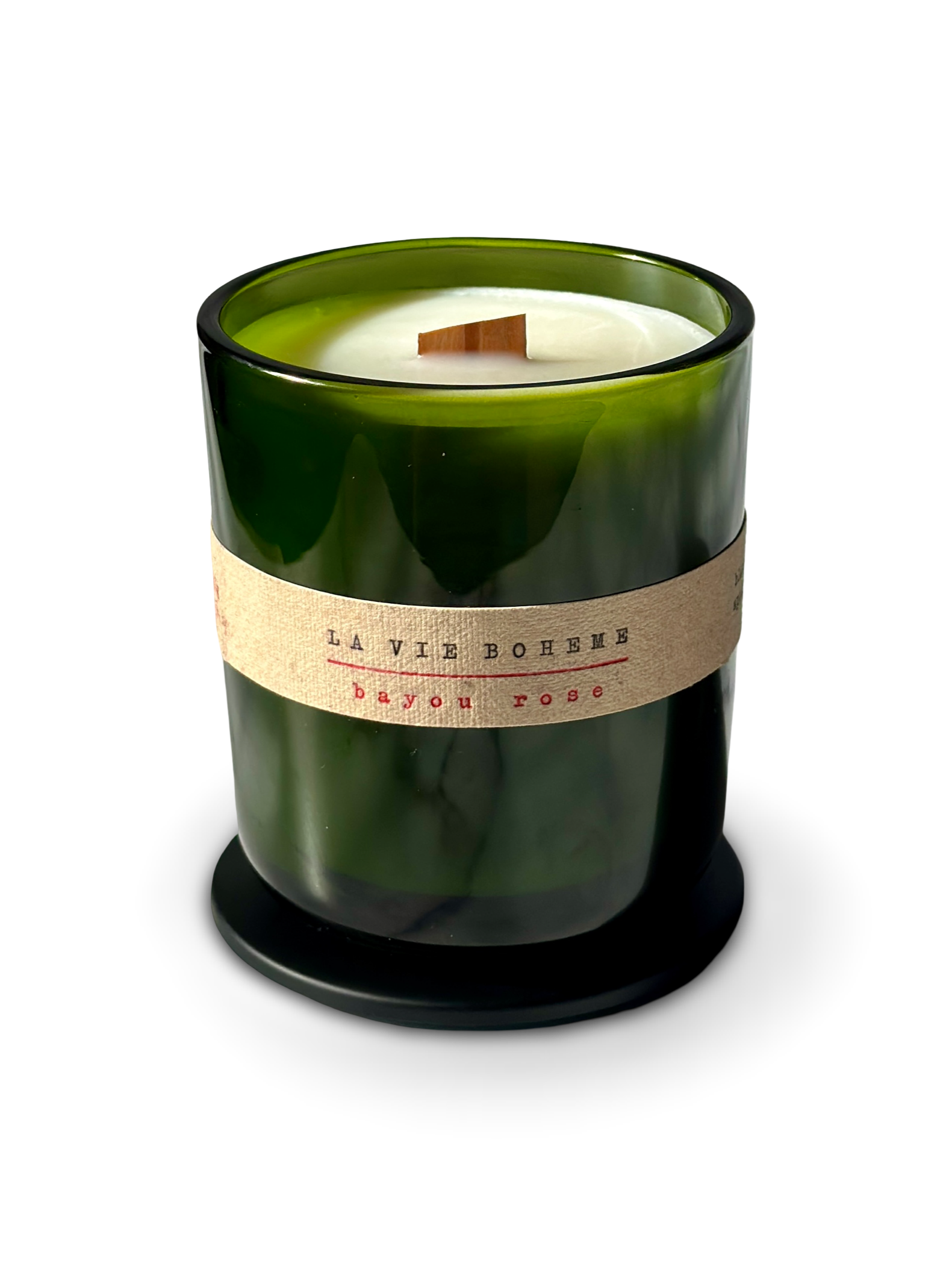 Olive oil coconut apricot wax candle in a green glass jar with a typewriter label on a white background