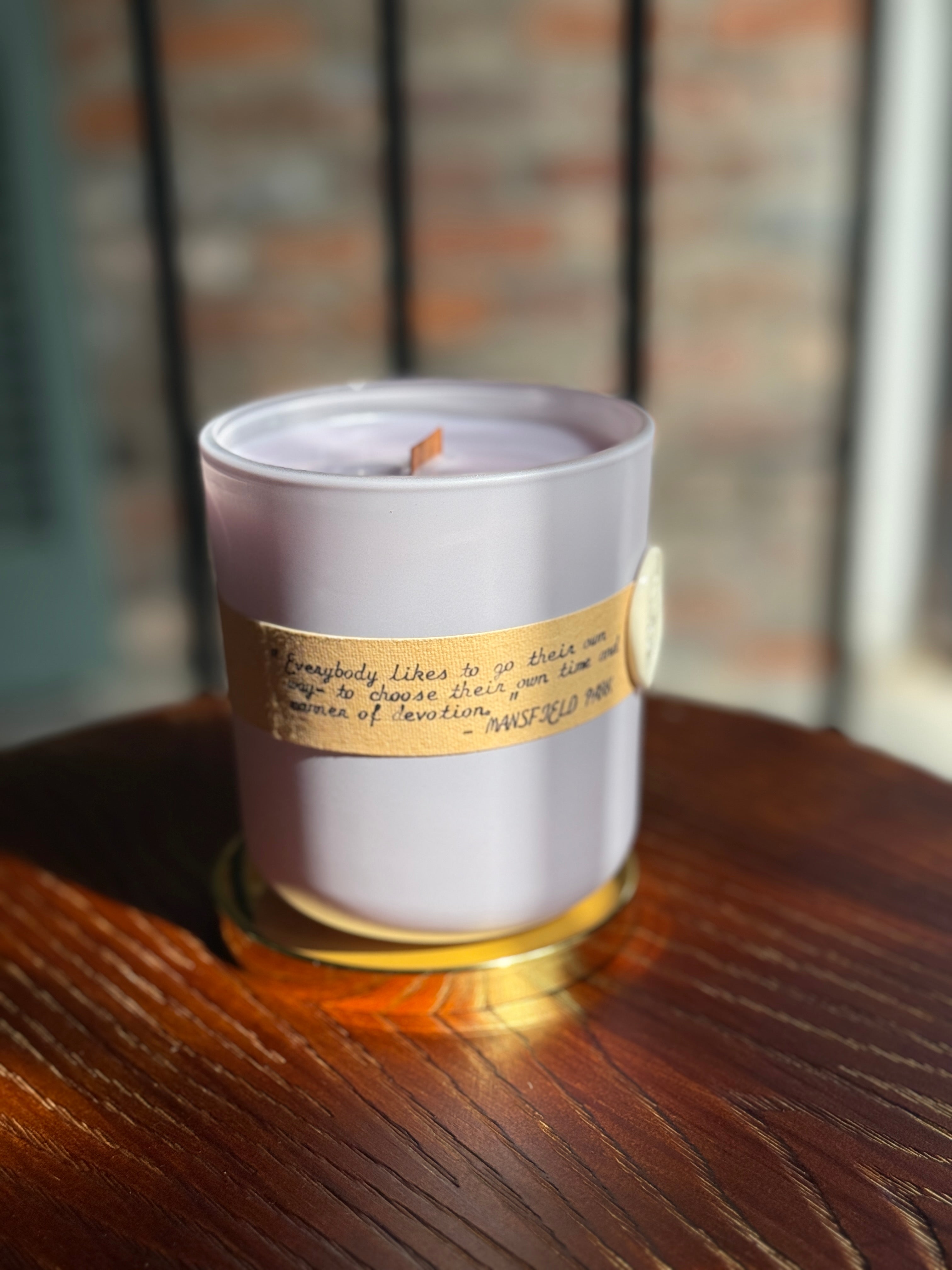 Bayou Rose Manner of Devotion candle — Mansfield Park inspired white tea and lavender candle on wood surface