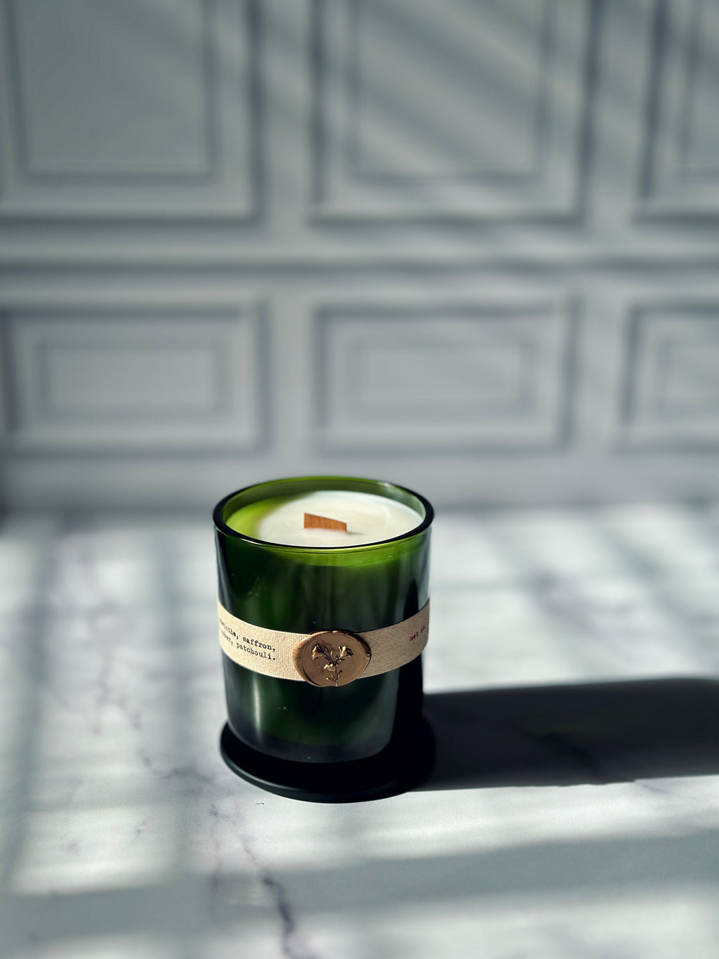 Close up of La Vie Boheme candle label with gold wax seal, absinthe patchouli saffron scented candle — Bayou Rose New Orleans