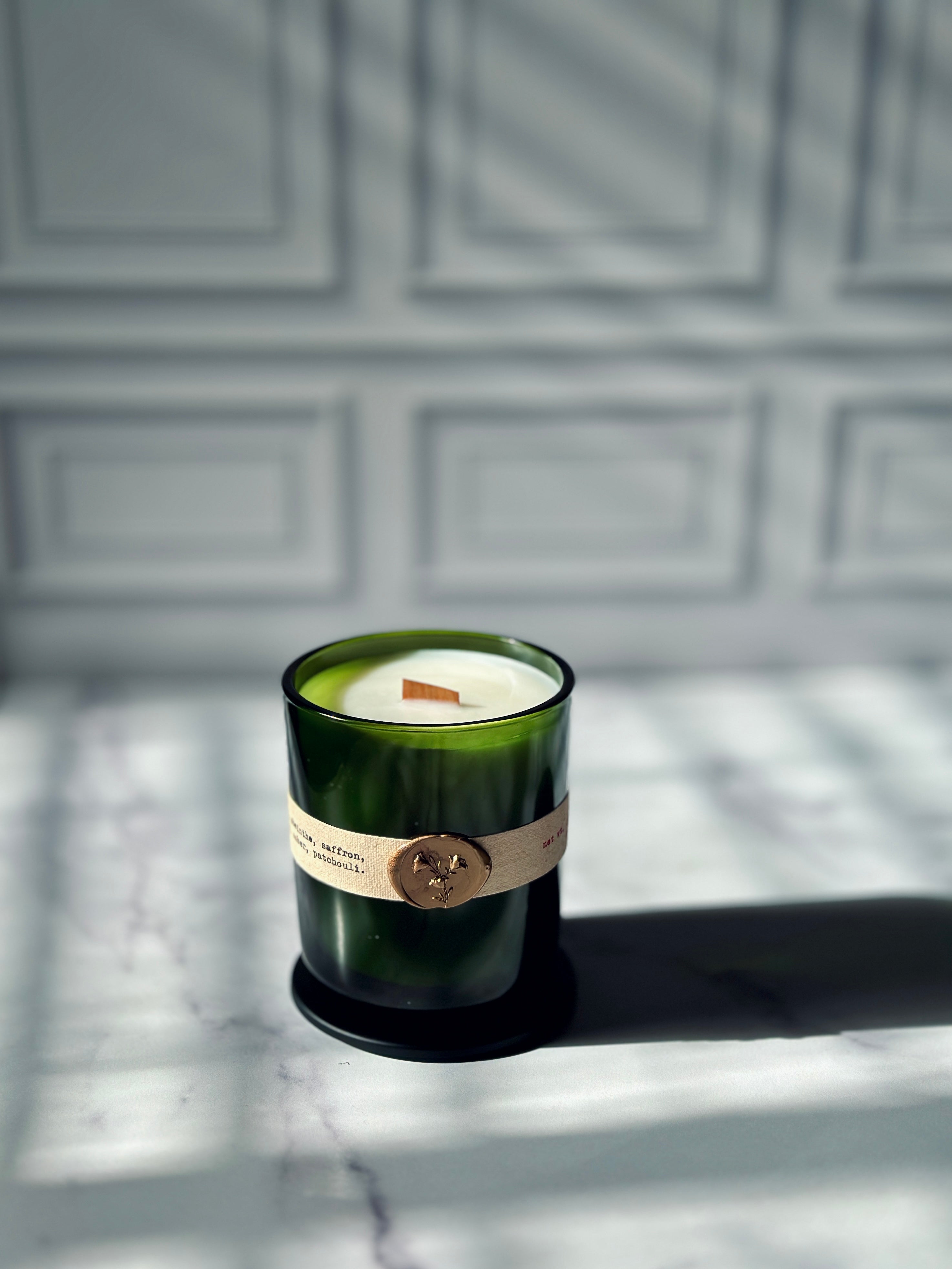 Close up of La Vie Boheme candle label with gold wax seal, absinthe patchouli saffron scented candle — Bayou Rose New Orleans